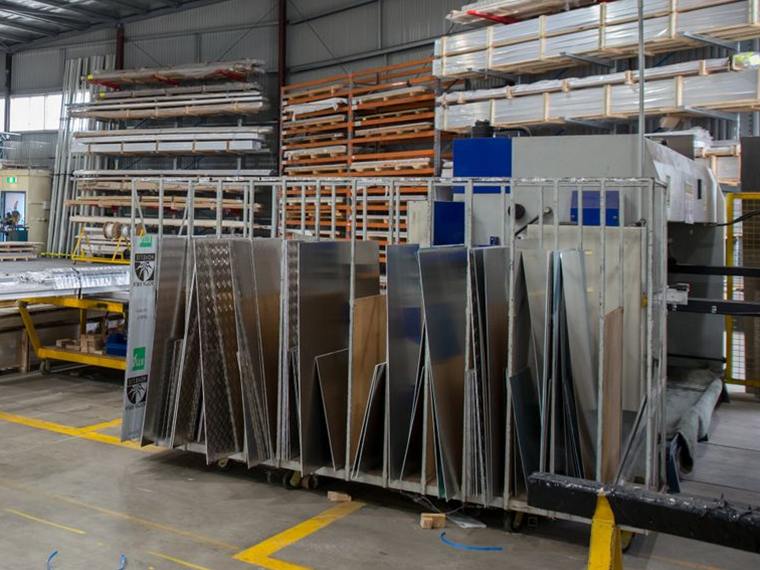 Stainless steel sheets and plates racked on edge in the stockyard